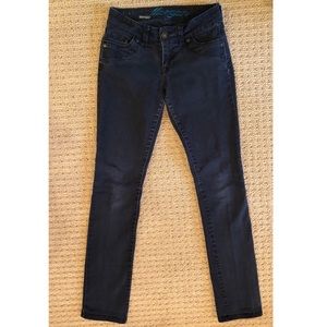 Faded black jeans w/detail stitching near pockets
